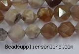 CFC300 15.5 inches 6mm faceted nuggets coral jade beads